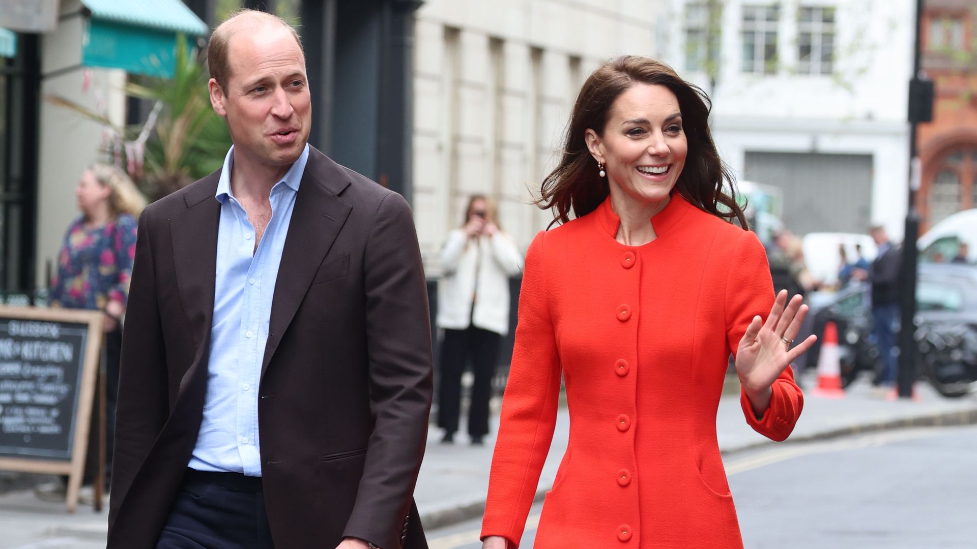 Prince William and Kate Middleton walking through Soho