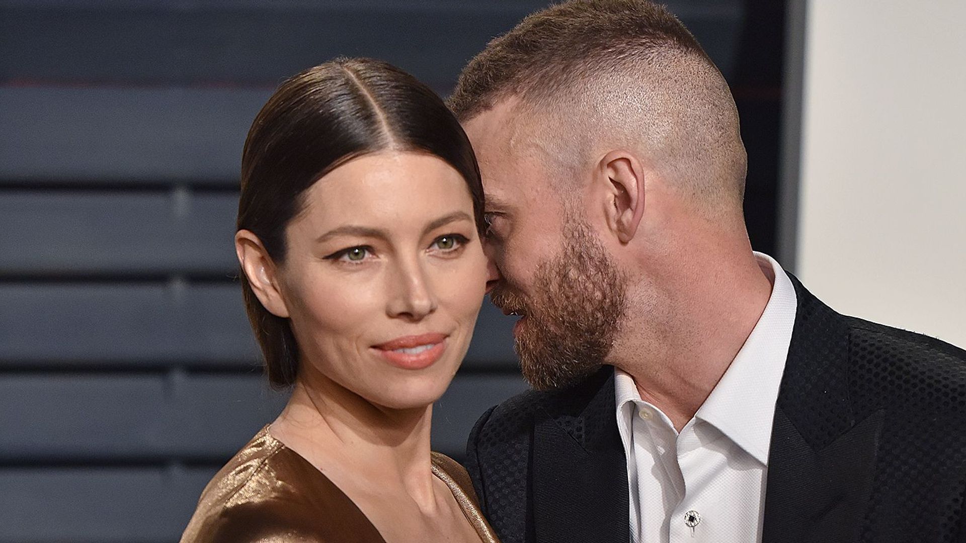 Justin Timberlake whispering to Jessica Biel on the red carpet