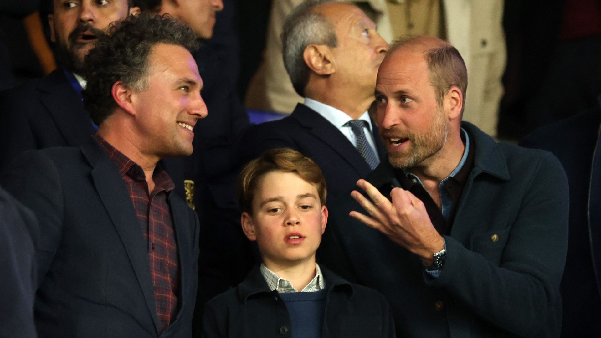 Thomas van Straubenzee, Prince George of Wales and Prince William, Prince of Wales interact in the stands during the UEFA Champions League 2024/25 Quarter Final First Leg match between Paris Saint-Germain and Aston Villa FC at Parc des Princes on April 09, 2025 in Paris, France.
