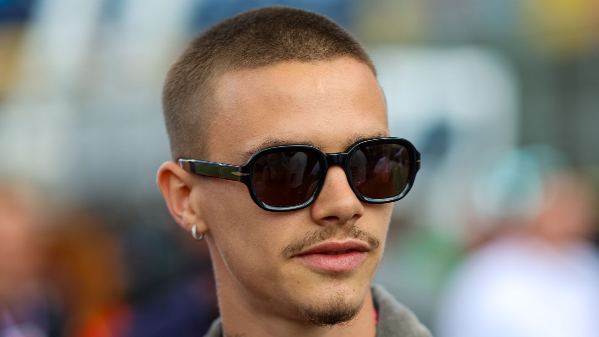 romeo beckham in black sunglasses at grand prix