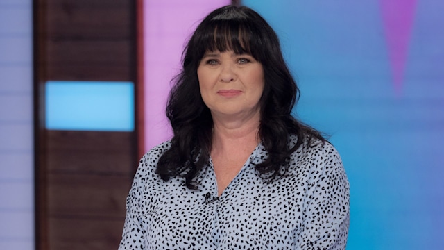 Coleen Nolan at desk