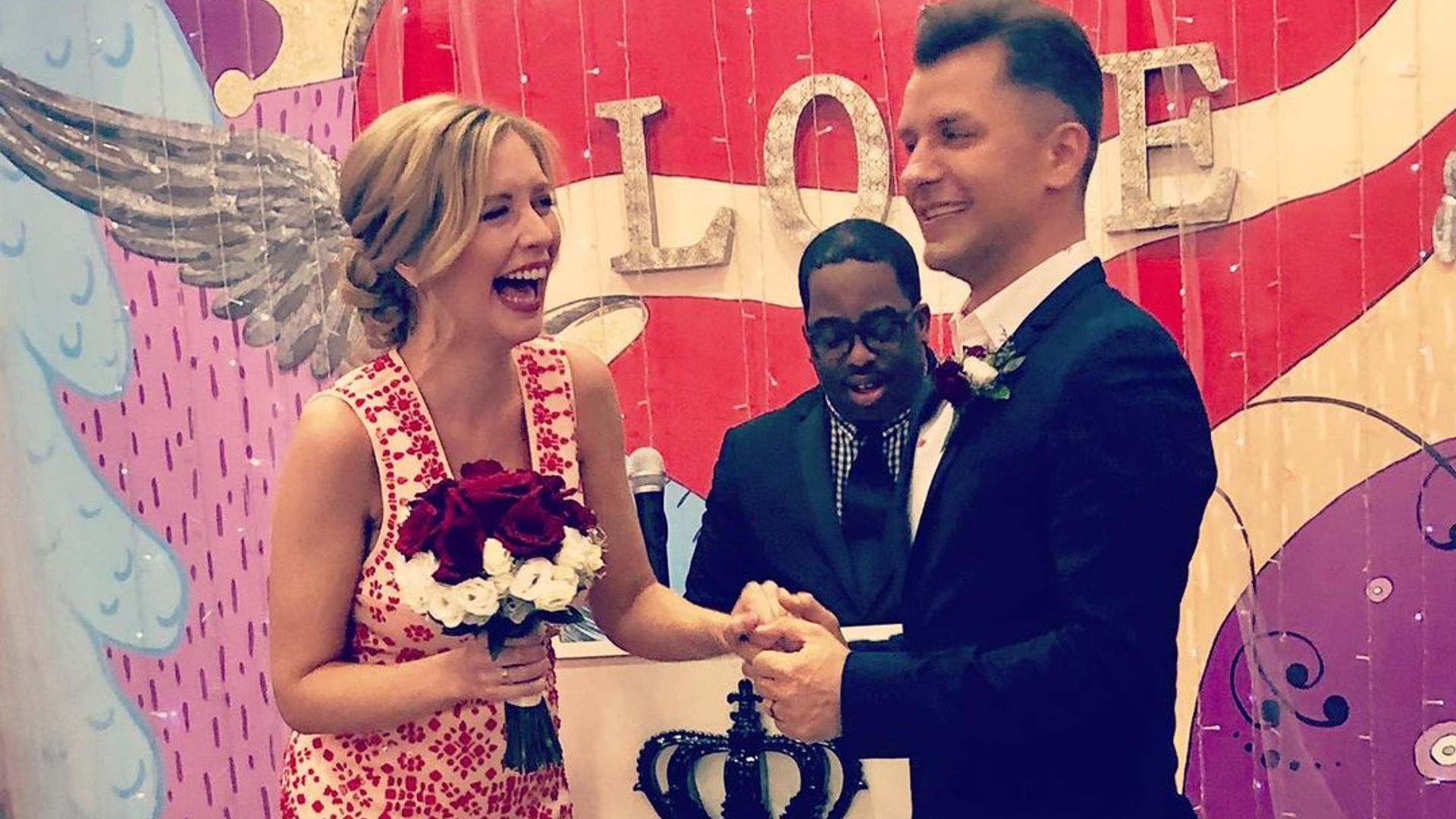 Rachel Riley laughing as she holds hands with Pasha during their Las Vegas wedding ceremony