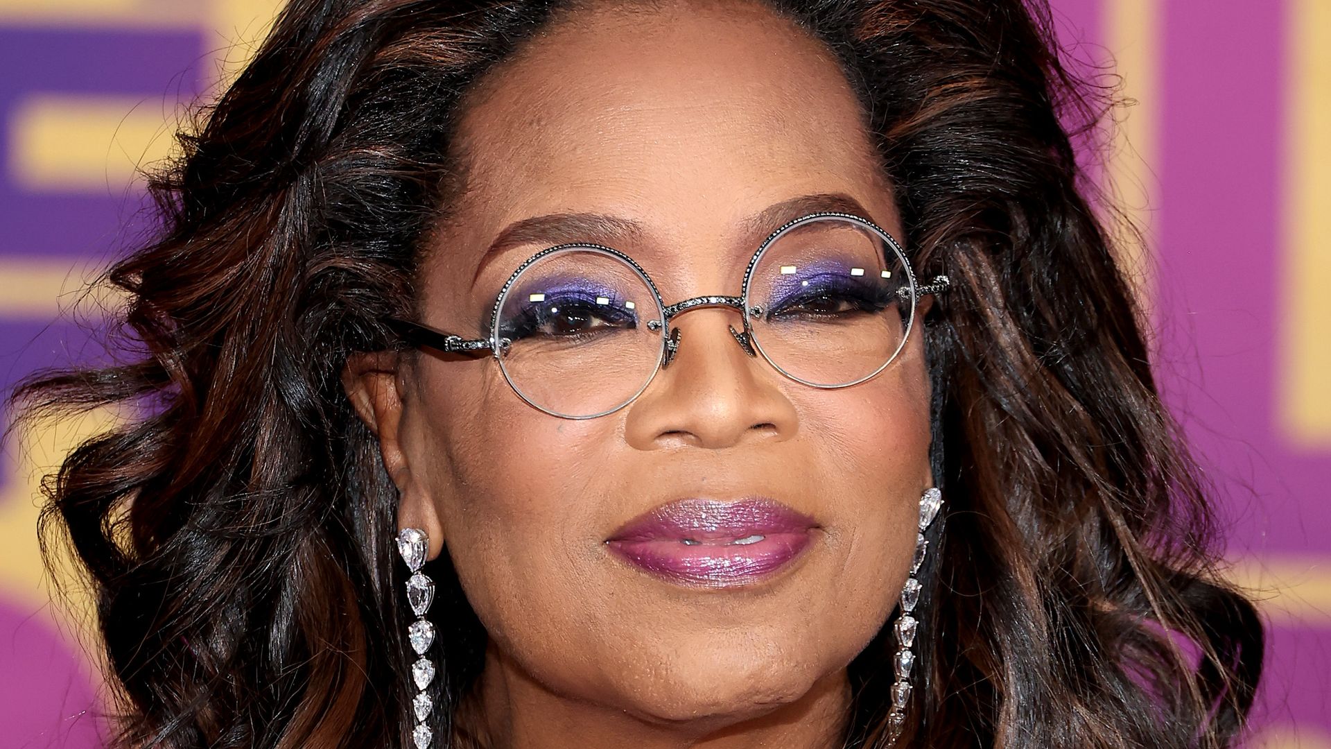 Oprah Winfrey in purple dress