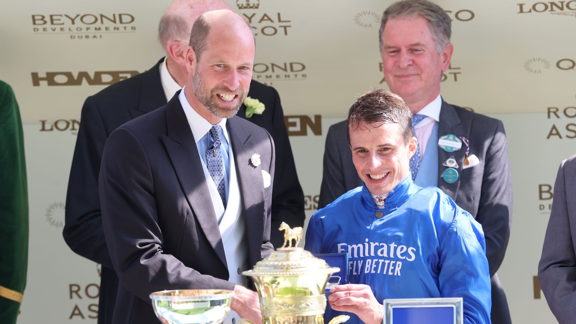 Prince William and William Buick with a trophy