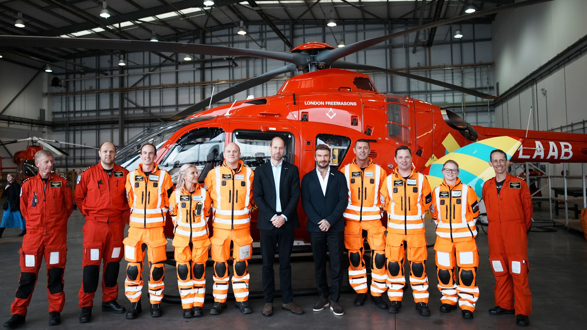 members of air ambulance crew with david beckham and prince william