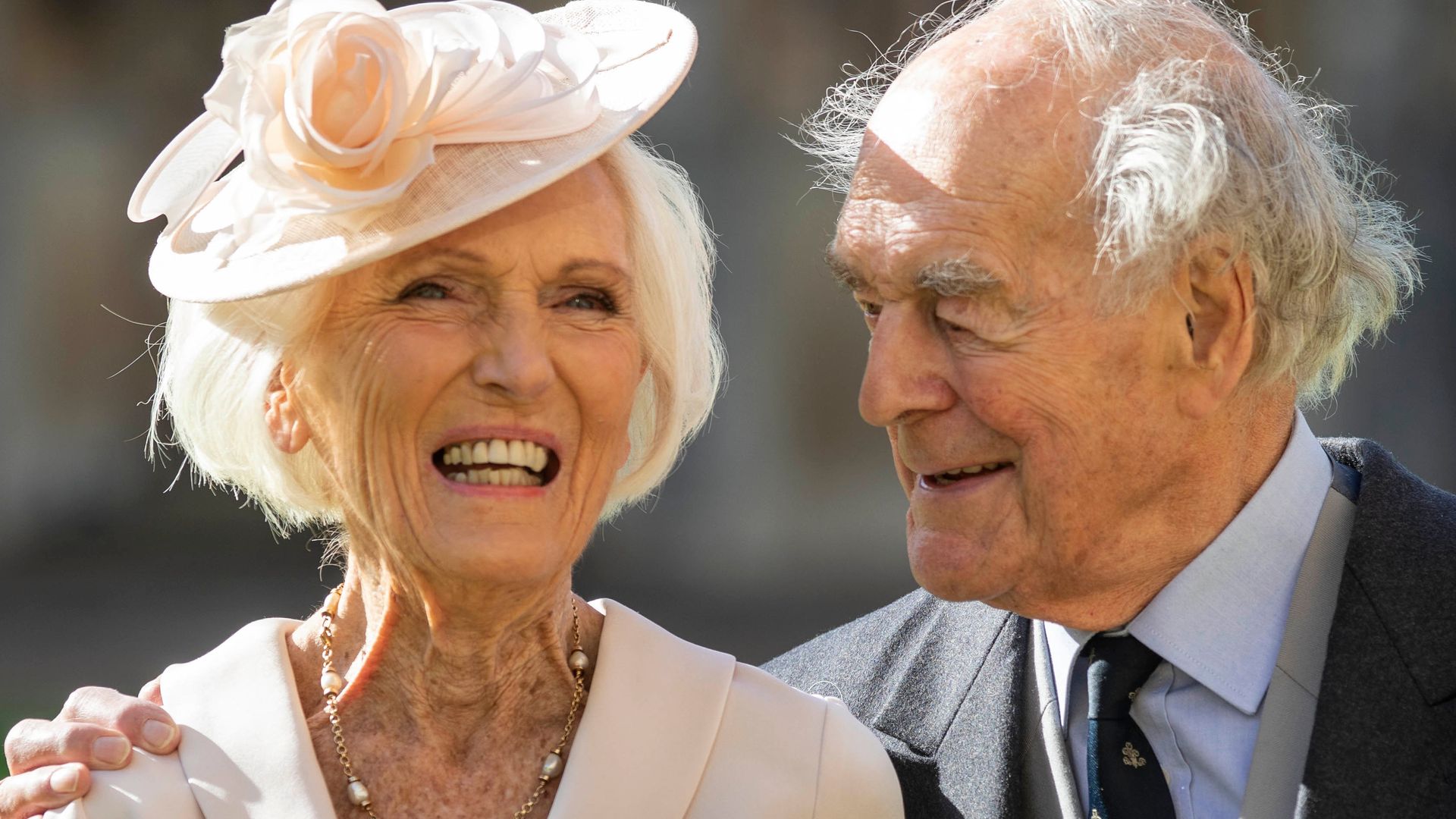 Mary Berry smiling outside Windsor Castle with her husband Paul Hunnings