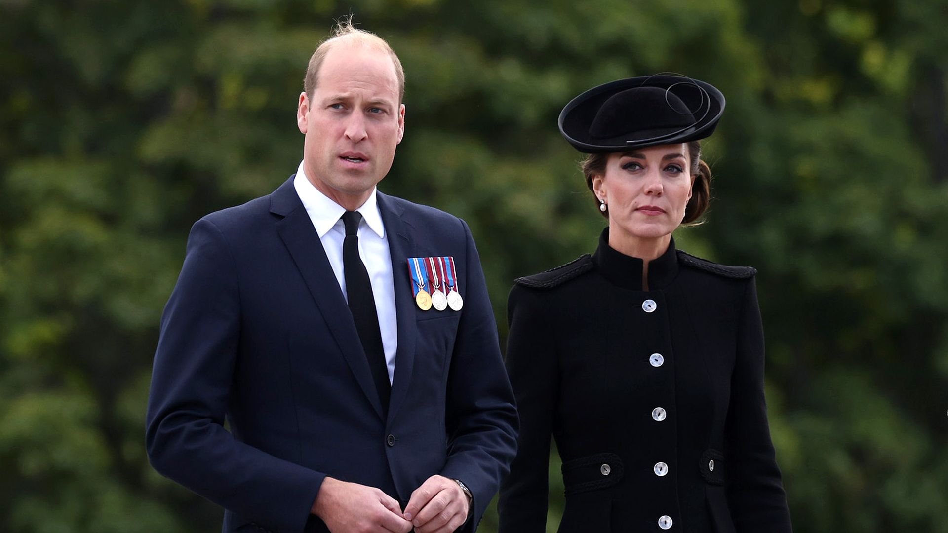 Prince William in suit and Kate Middleton in black dress