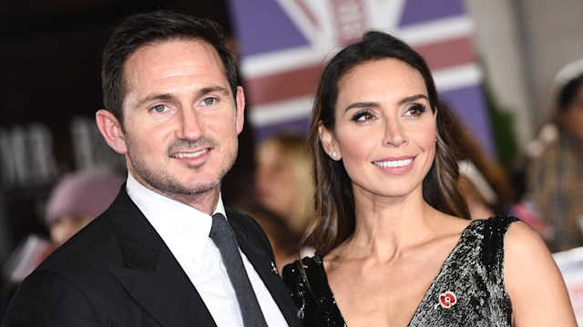 Frank Lampard in a black suit with Christine Lampard in a black dress