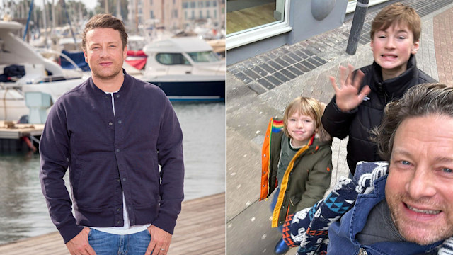 Jamie Oliver by quayside beside photo of jamie with his two sons