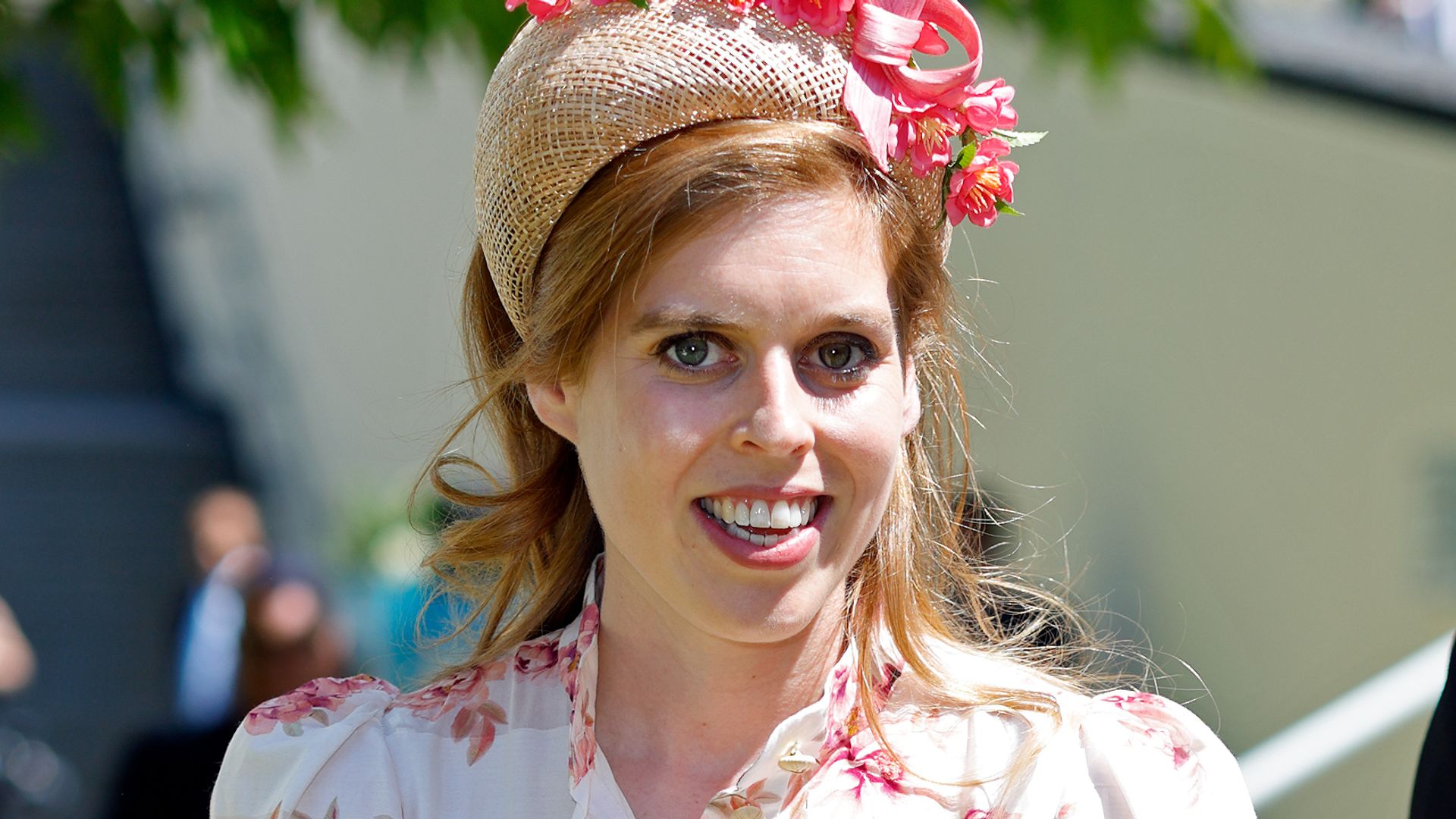 Princess Beatrice smiling in pink floral dress