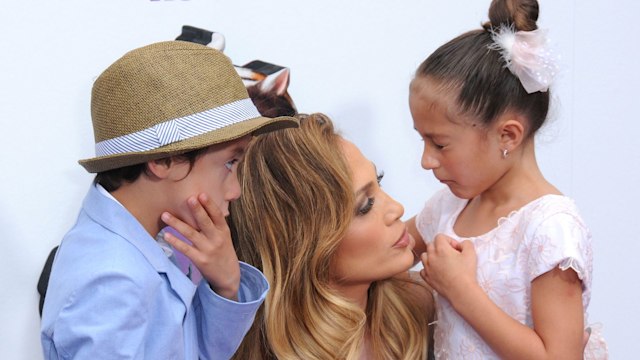 Jennifer Lopez talks to Emme and MAx at an event when they were young