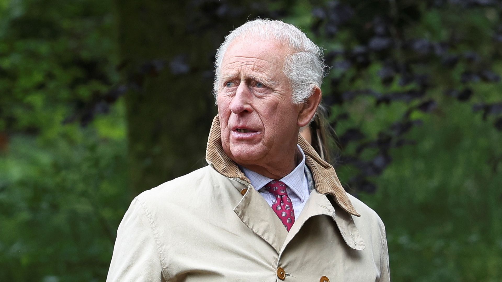 King Charles in trench coat in Lancashire