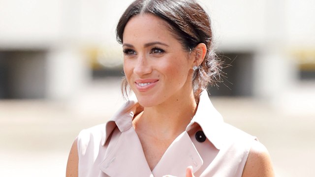 Meghan, Duchess of Sussex  in a pink wrap dress