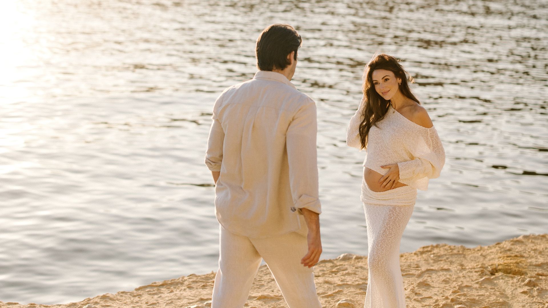Mark Wright and Michelle Keegan on a beach during a pregnancy shoot in Majorca