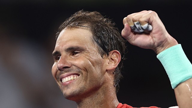 man celebrating on tennis court