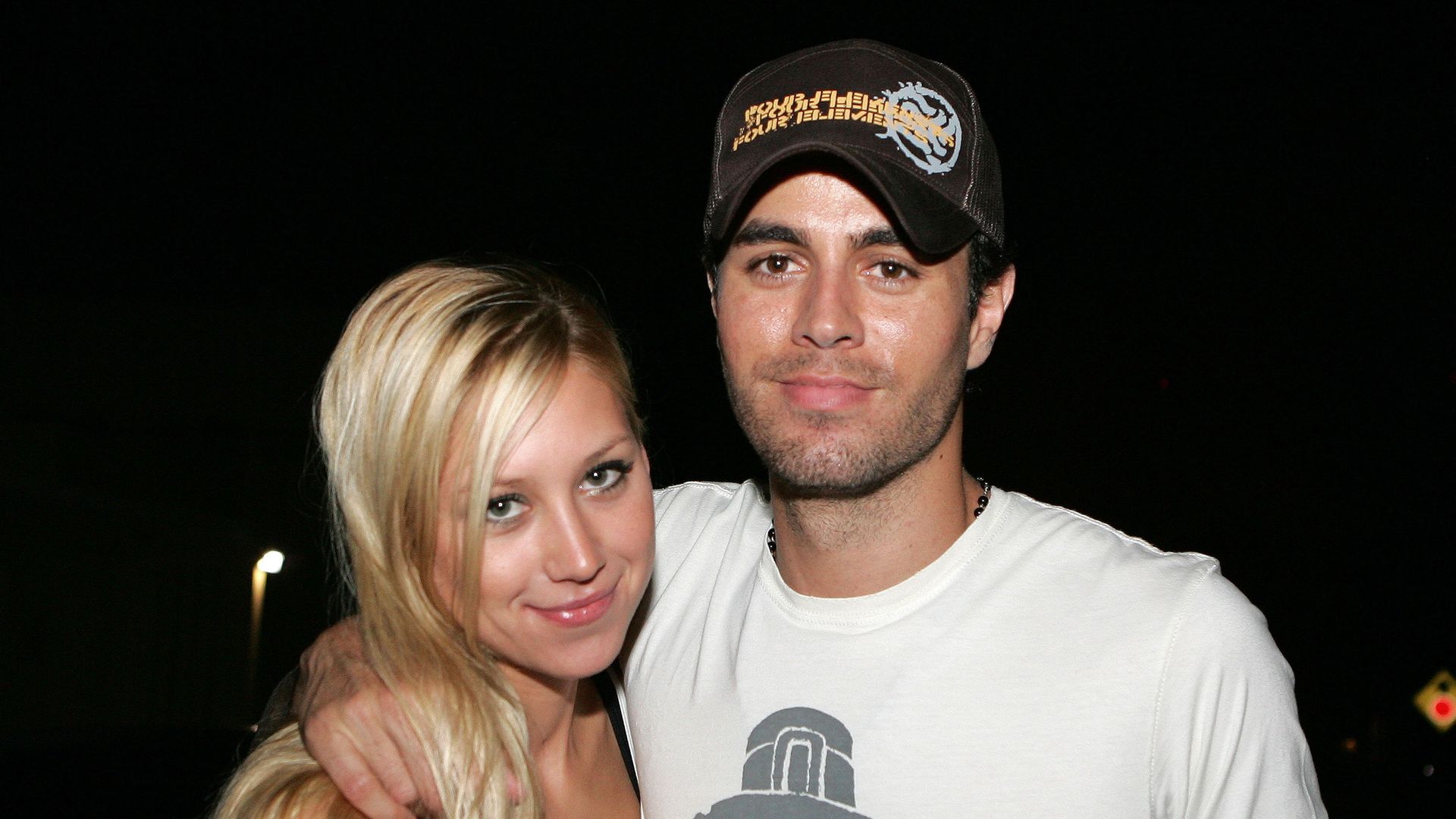 Tennis player Anna Kournikova and singer Enrique Iglesias leave Big Pink restaurant during the early morning hours on June 16, 2006 in Miami, Florida.