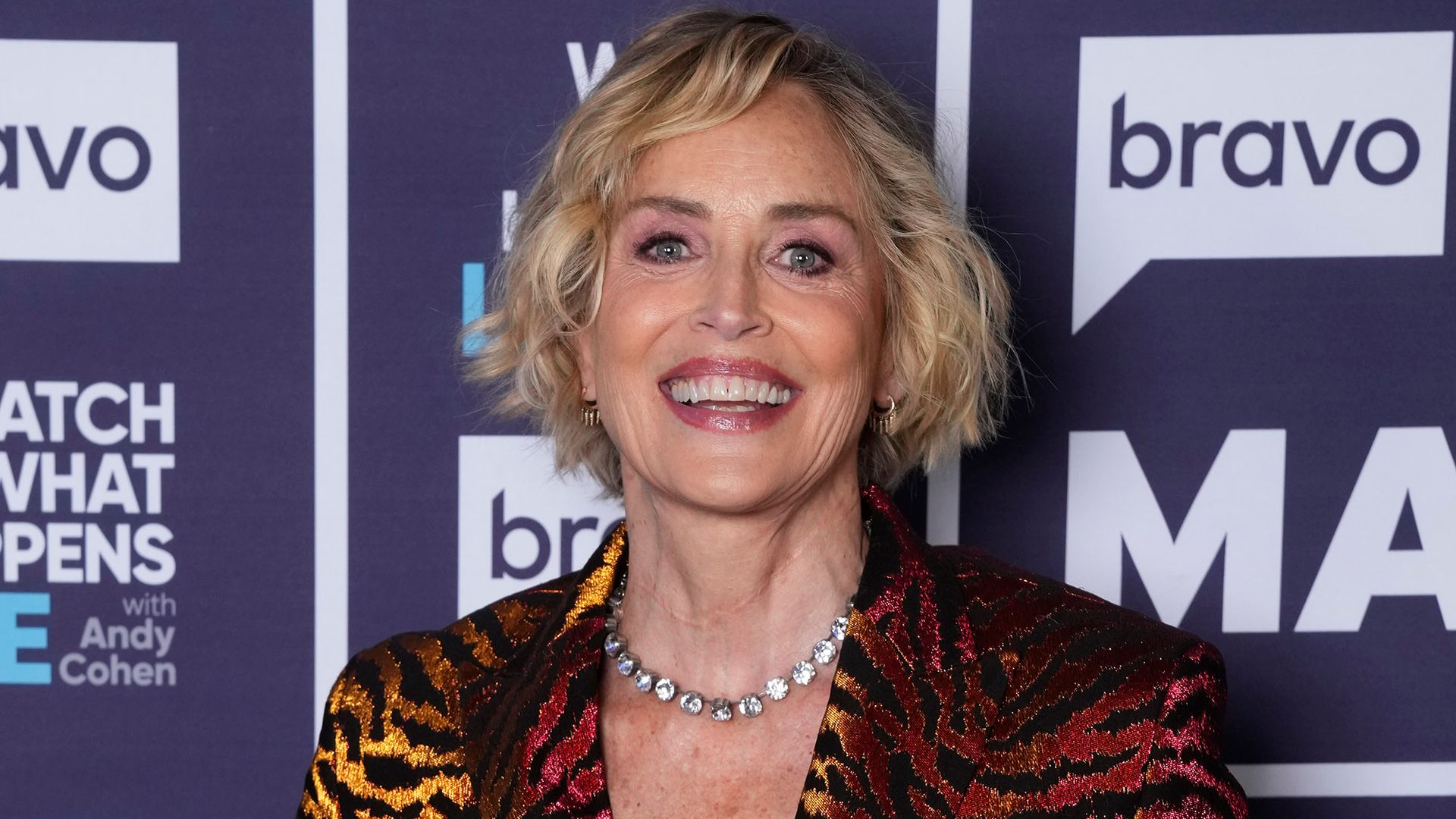 sharon stone wearing animal print suit