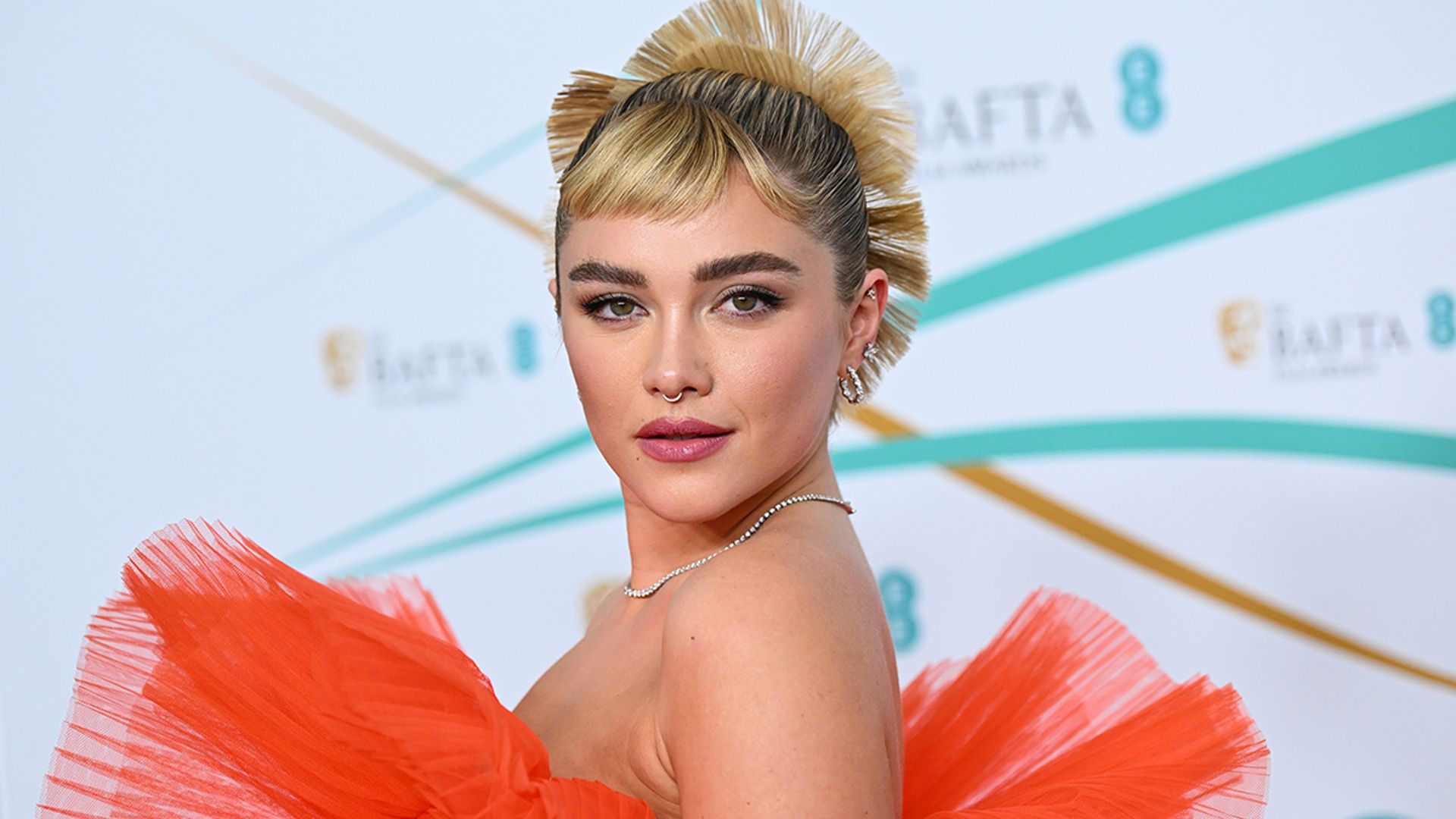 Florence Pugh puts a vibrant spin on the visible lingerie trend at the 2023 BAFTAs