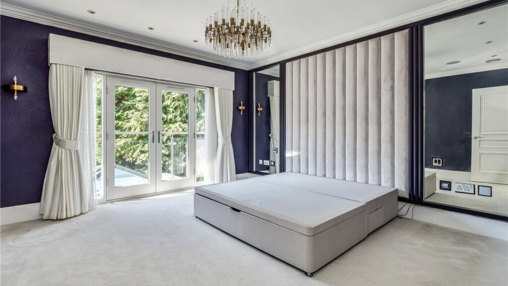 A bedroom with purple walls