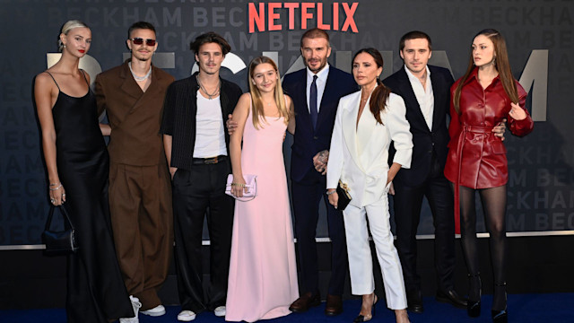 Mia Regan standing with Romeo Beckham, Cruz Beckham, Harper Beckham, David Beckham, Victoria Beckham, Brooklyn Beckham and Nicola Peltz