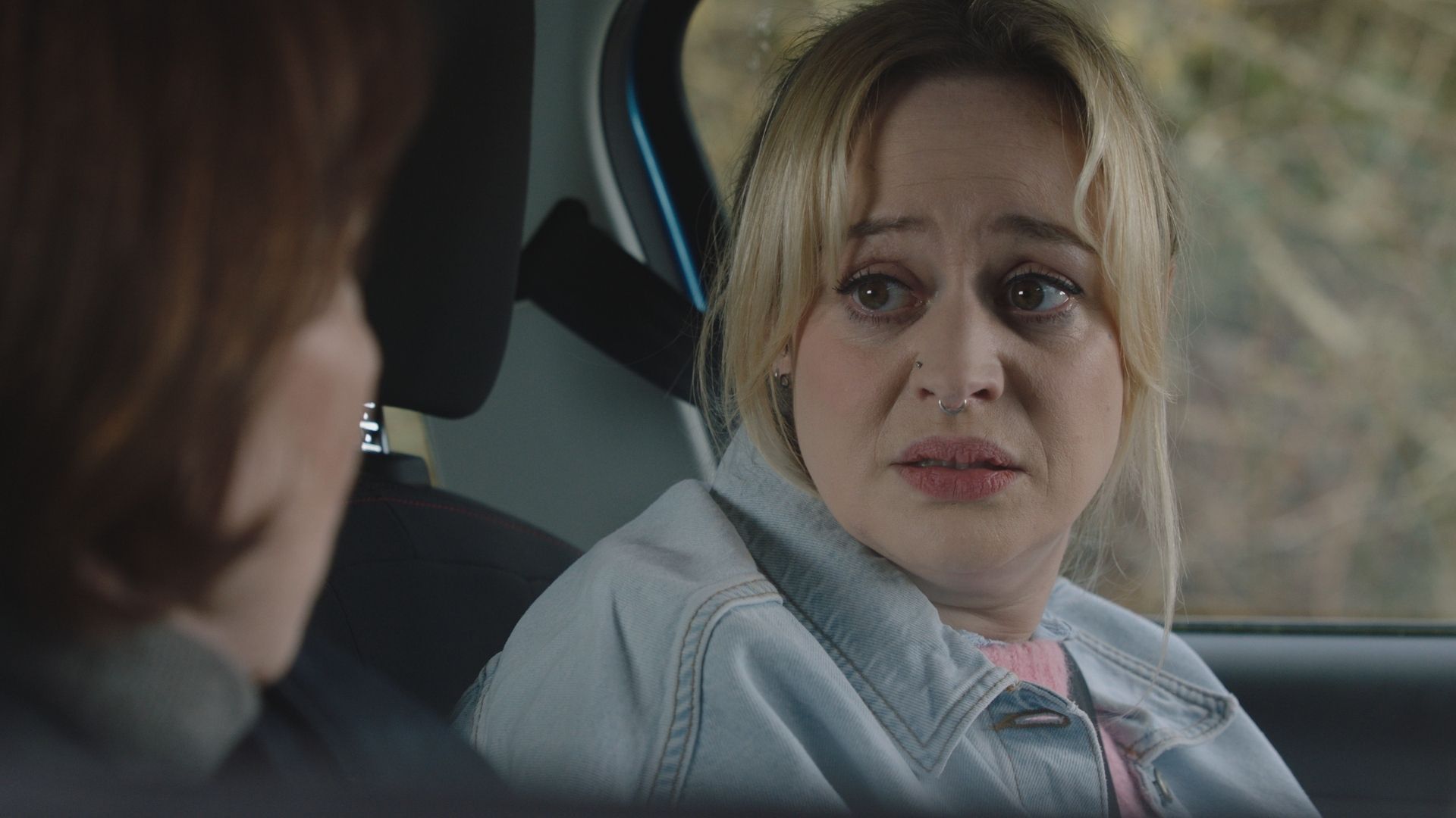 Sammy T Dobson as Nicole Piper in a car