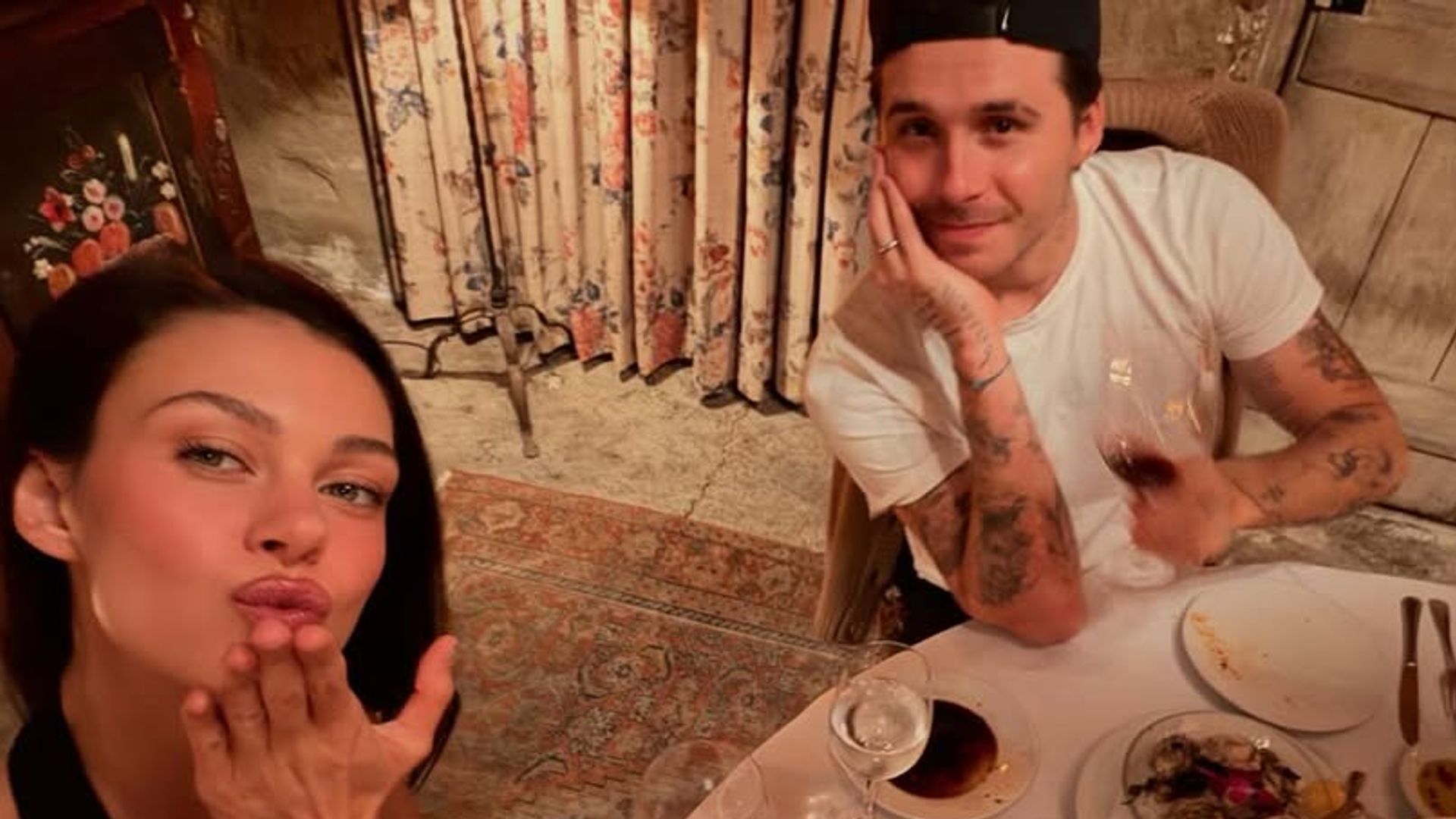 woman and man eating dinner round table