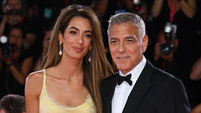 Amal Clooney and George Clooney walk the red carpet arm in arm at the 'Wolfs' premiere, 81st Venice International Film Festival, Italy