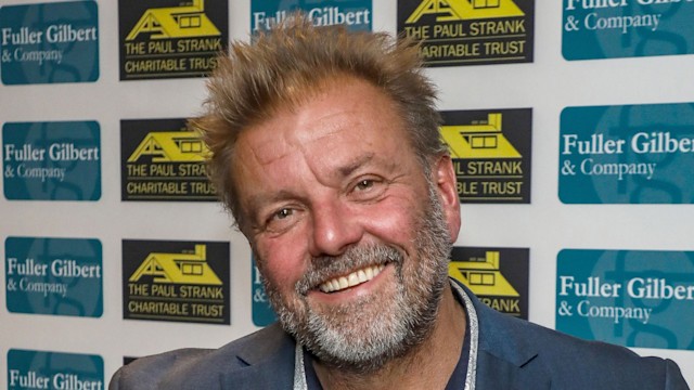 Martin Roberts in a blue suit