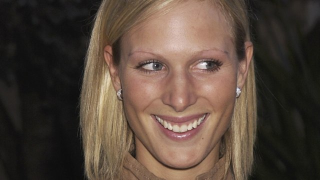 zara tindall smiling with camel coloured top 