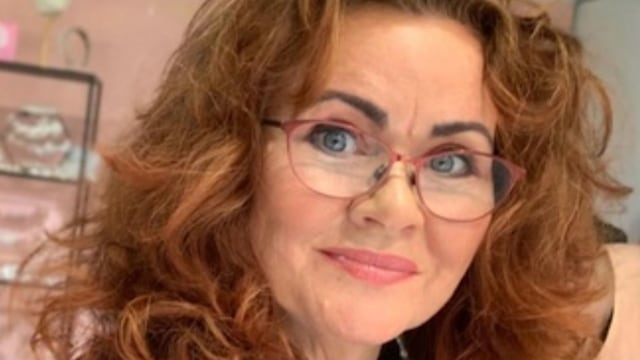 woman with big curly red hair 