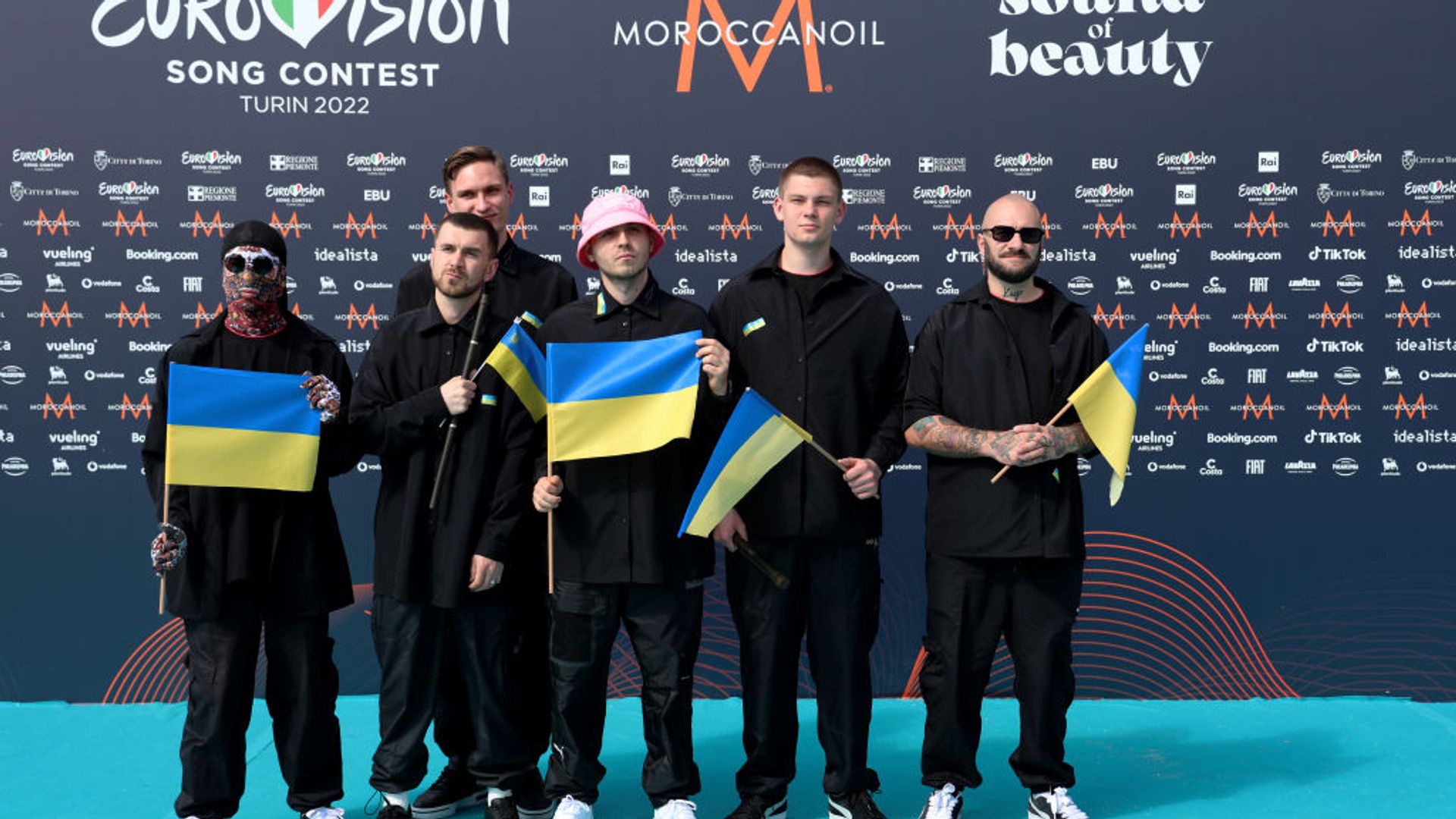Winners Kalush Orchestra holding Ukraine flags in 2022