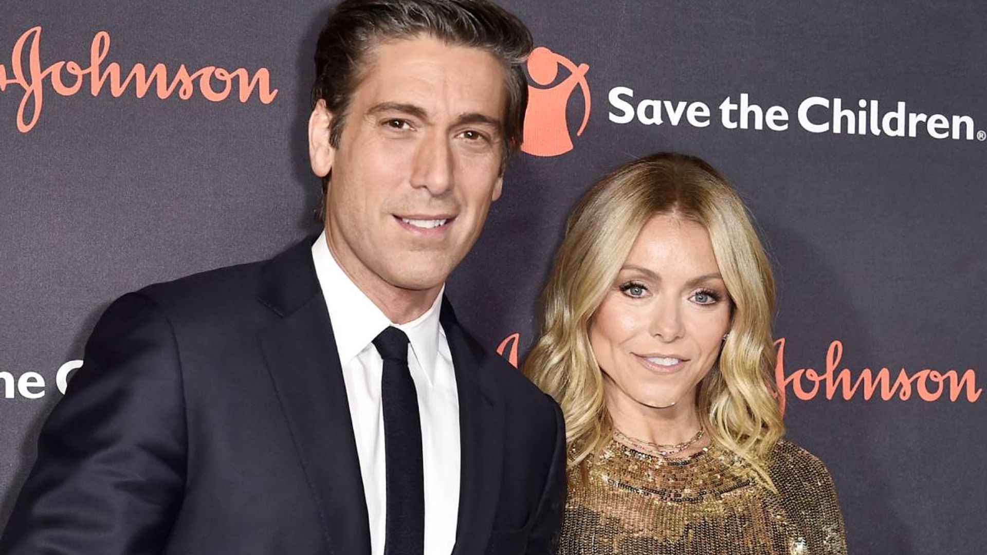 kelly ripa supported by david muir