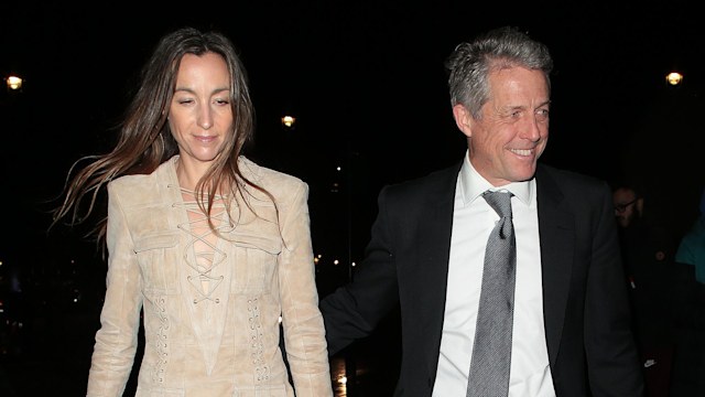 Anna Eberstein and Hugh Grant walking