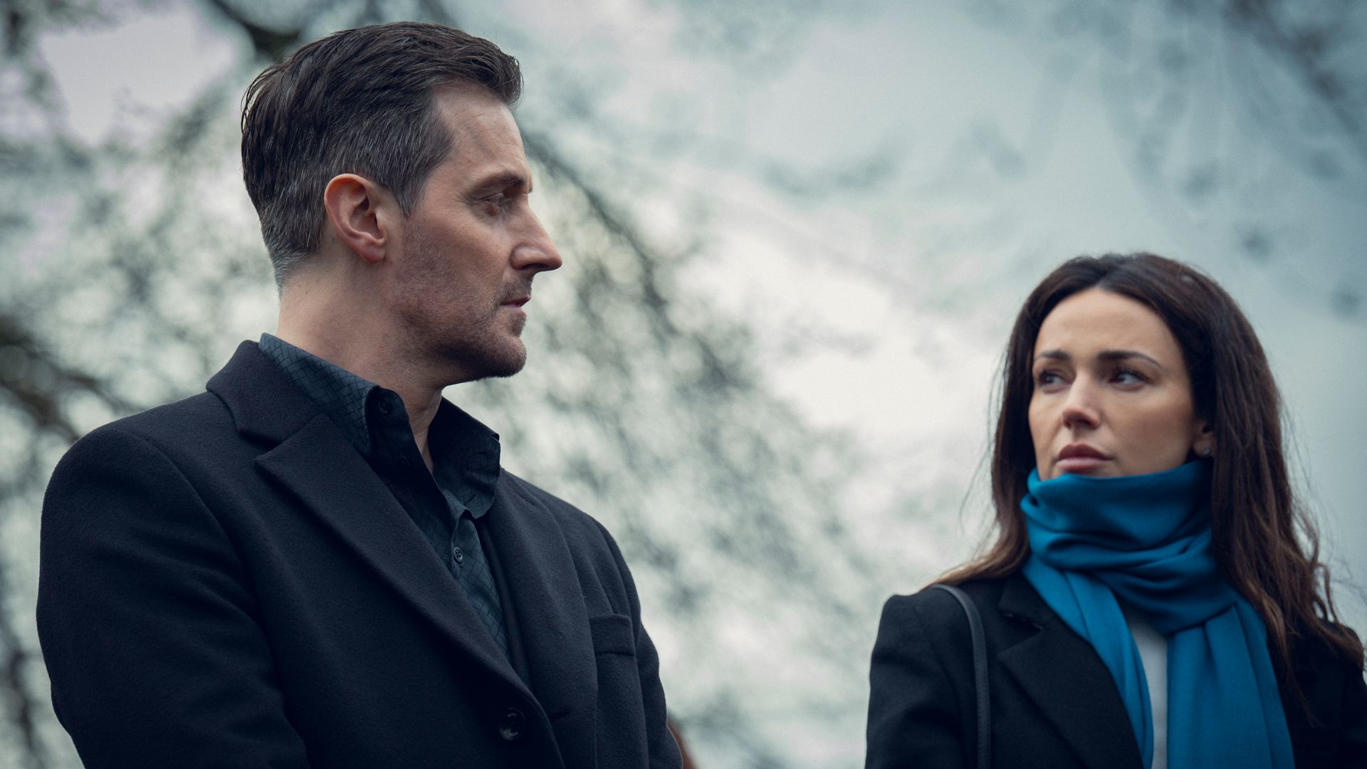 man and woman looking at each other