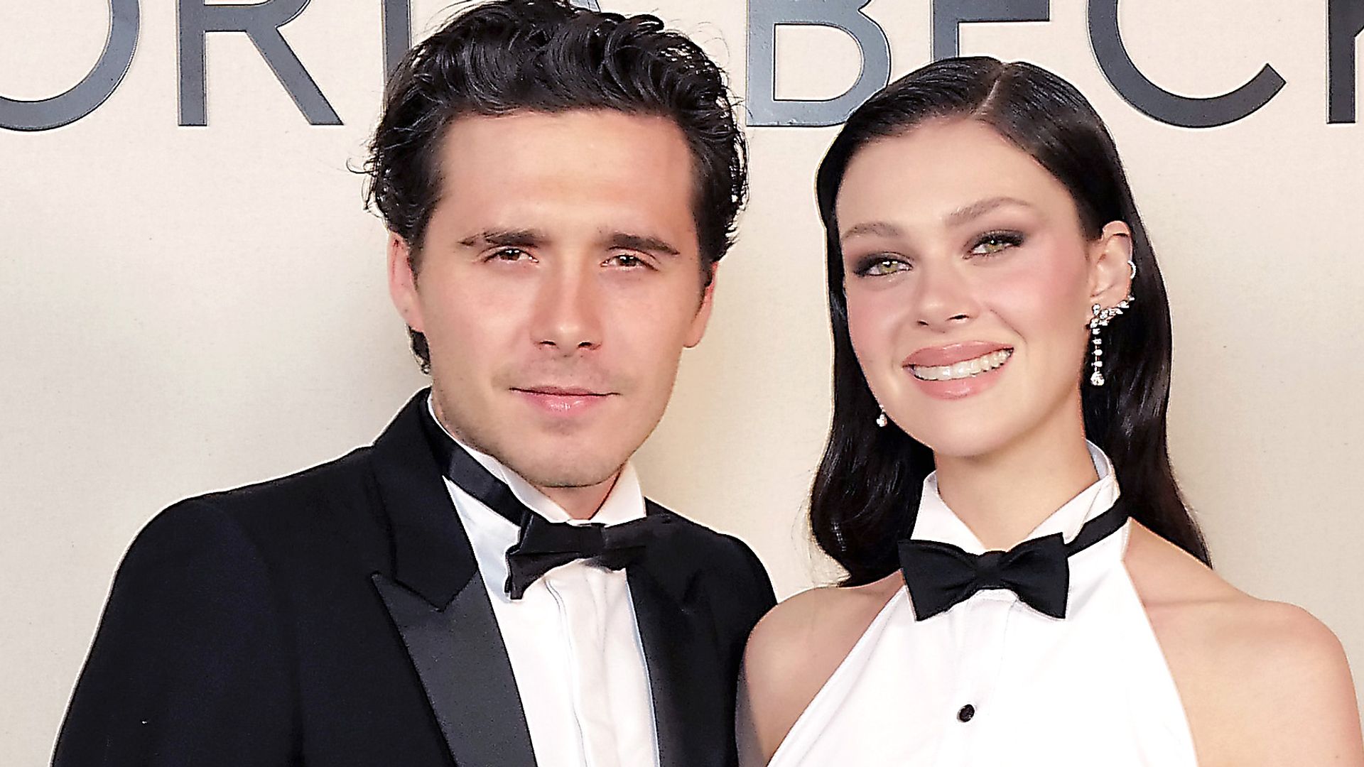 Brooklyn Beckham and Nicola Peltz in suits