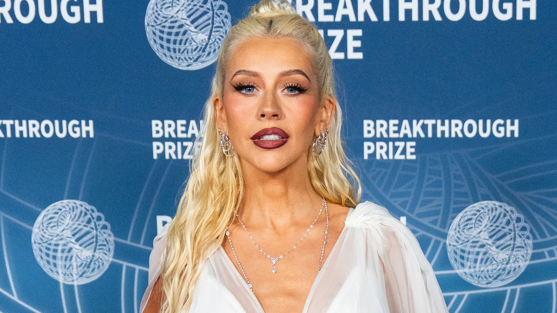 christina aguilera wearing white corset dress