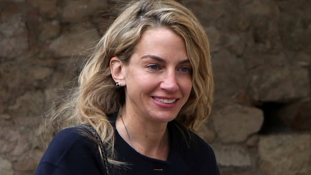 Chrysi Vardinogianni in a black jacket holding a water bottle