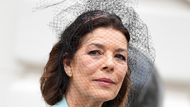 Princess Caroline of Monaco wearing an aqua suit 