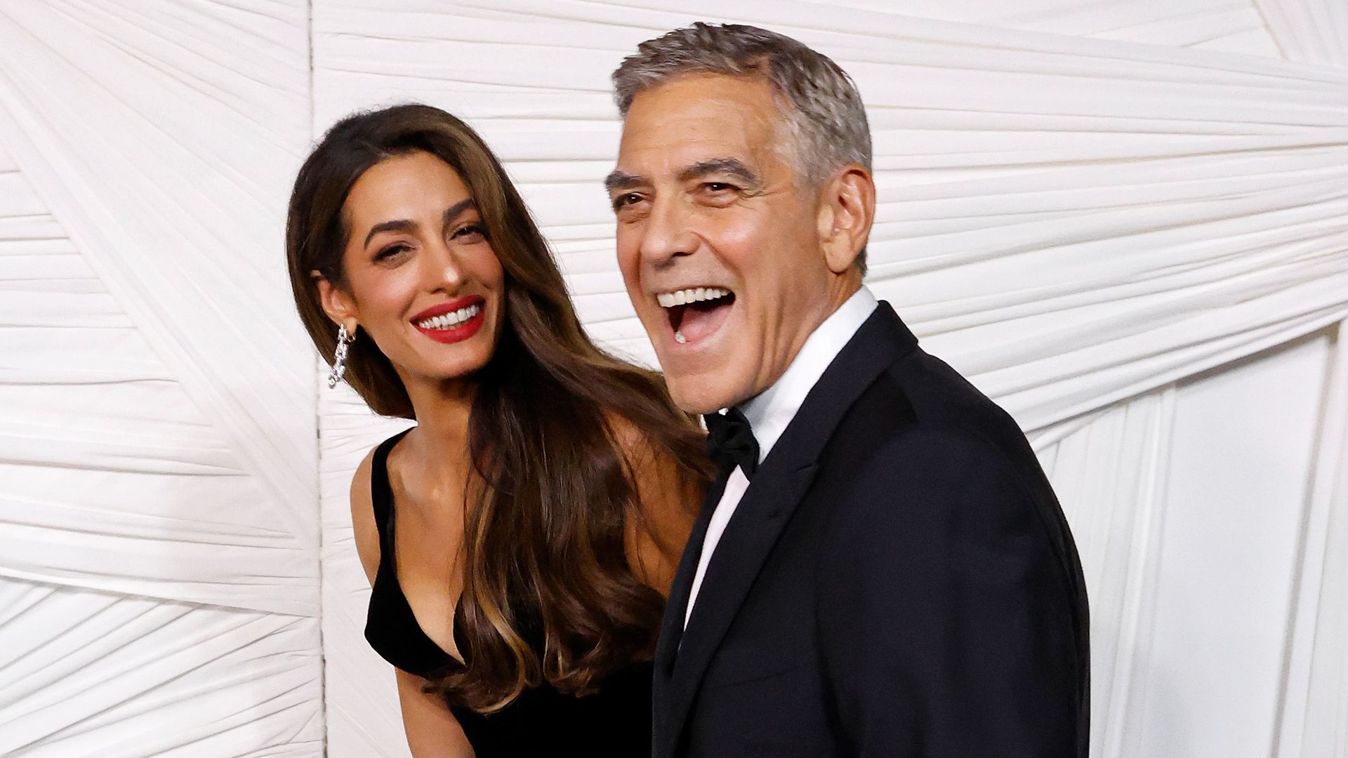 George Clooney can't keep his eyes off Amal as pair enjoy early wedding anniversary with A-list friends