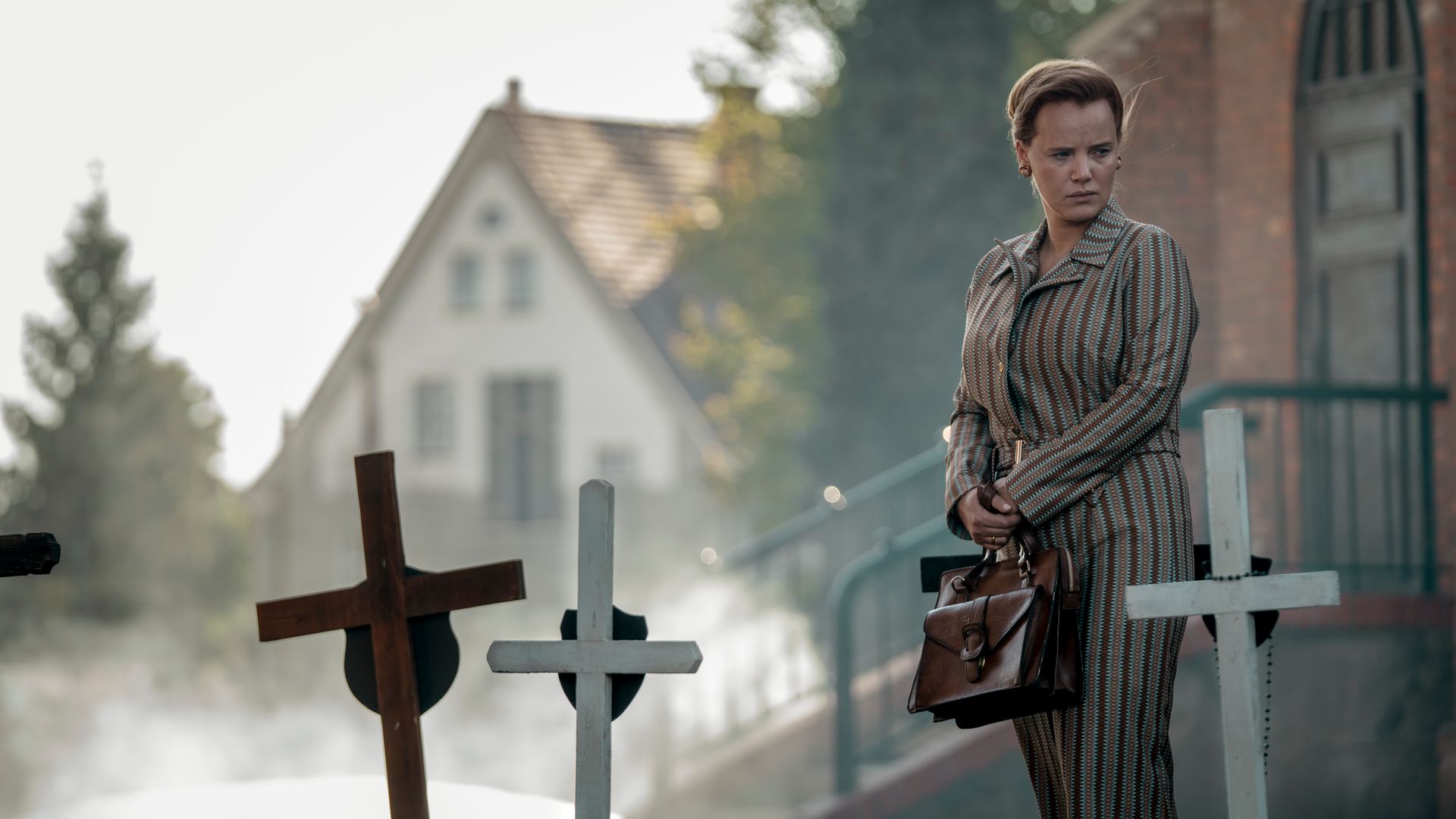 Joanna Kulig in a still from Lead Children where she stands in a graveyard
