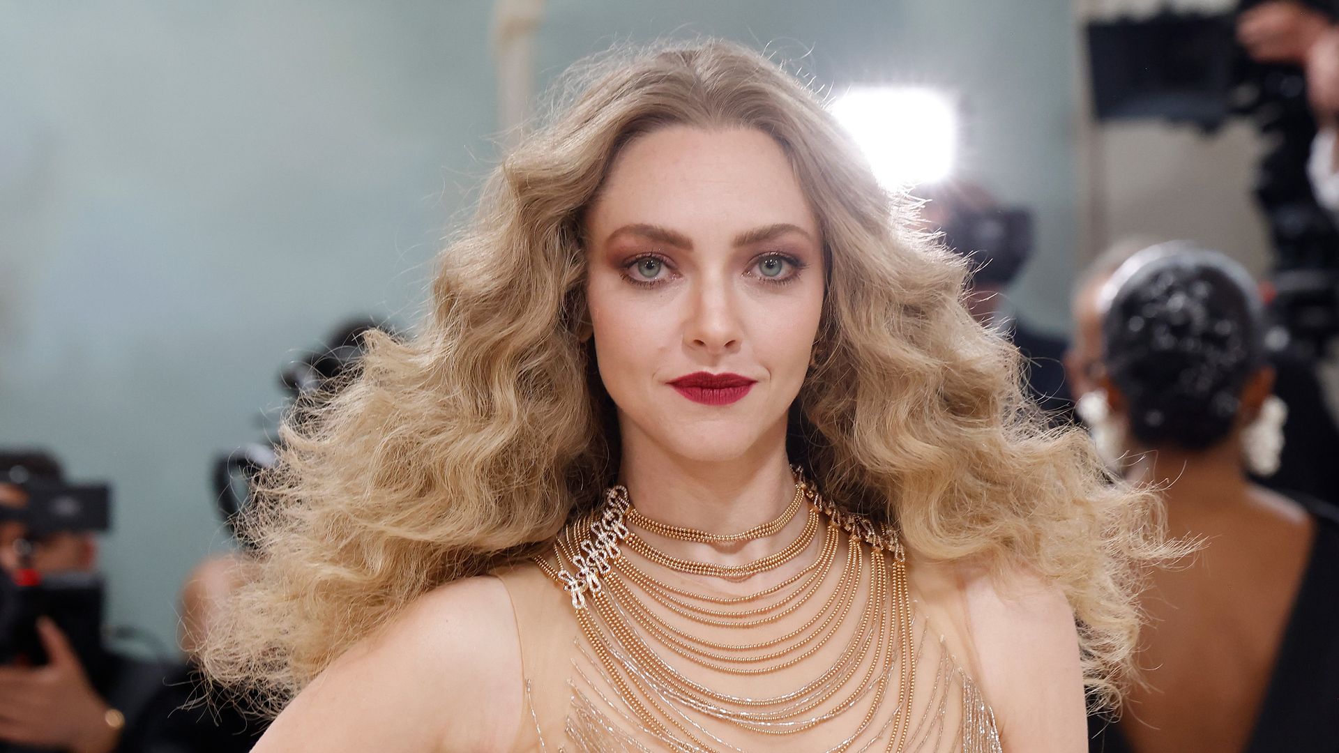 Amanda Seyfried with curly hair in bead dress