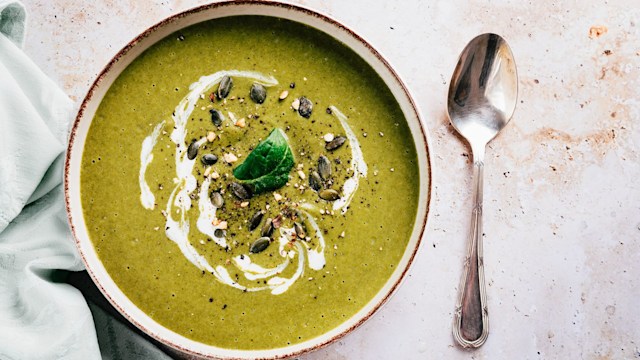 Flat lay of soup made with green vegetables and cream