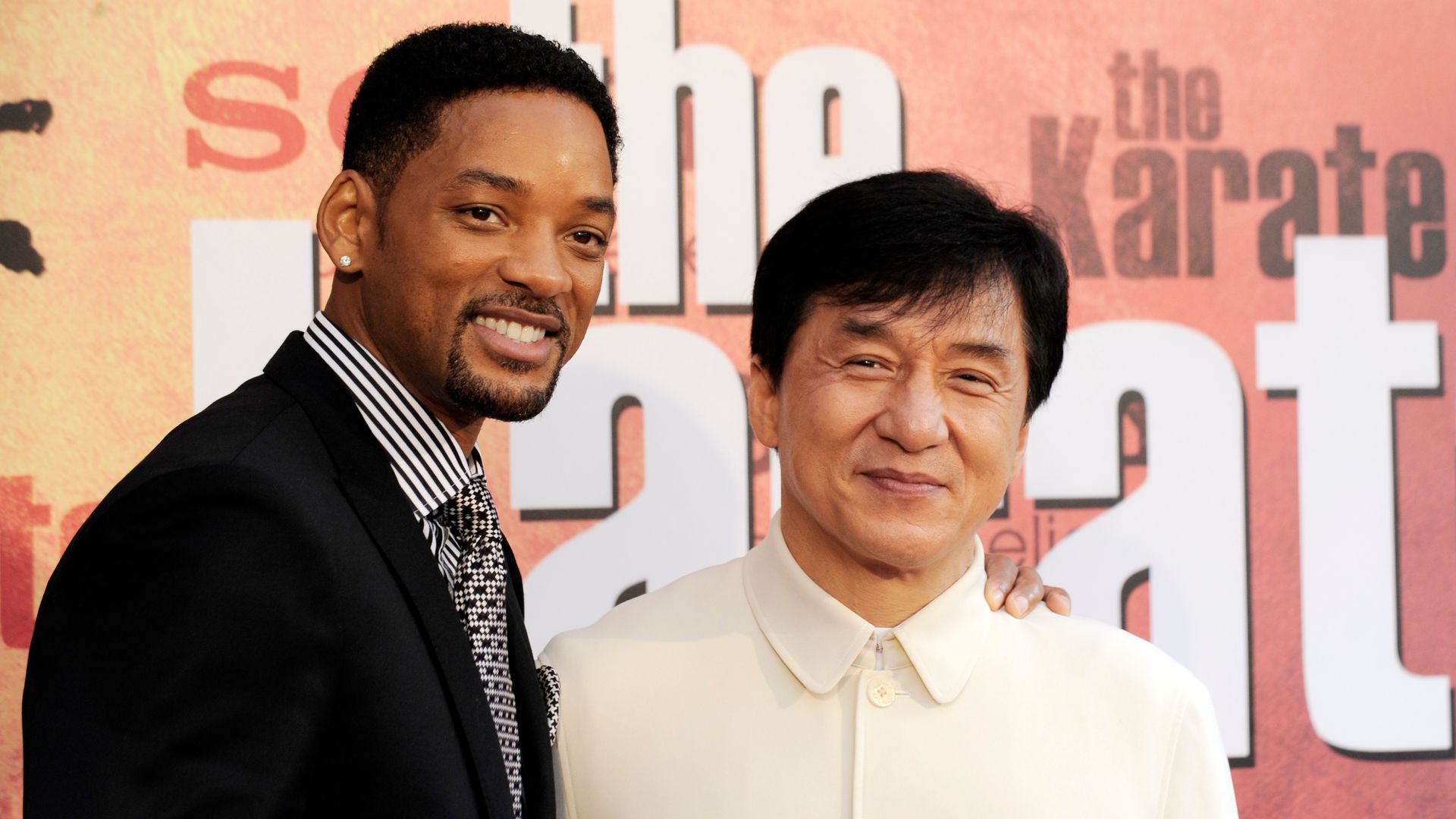Will Smith and Jackie Chan pose for photographers upon their arrival prior to the premiere of the film "The Karate Kid" on July 25, 2010 at the Grand Rex cinema in Paris