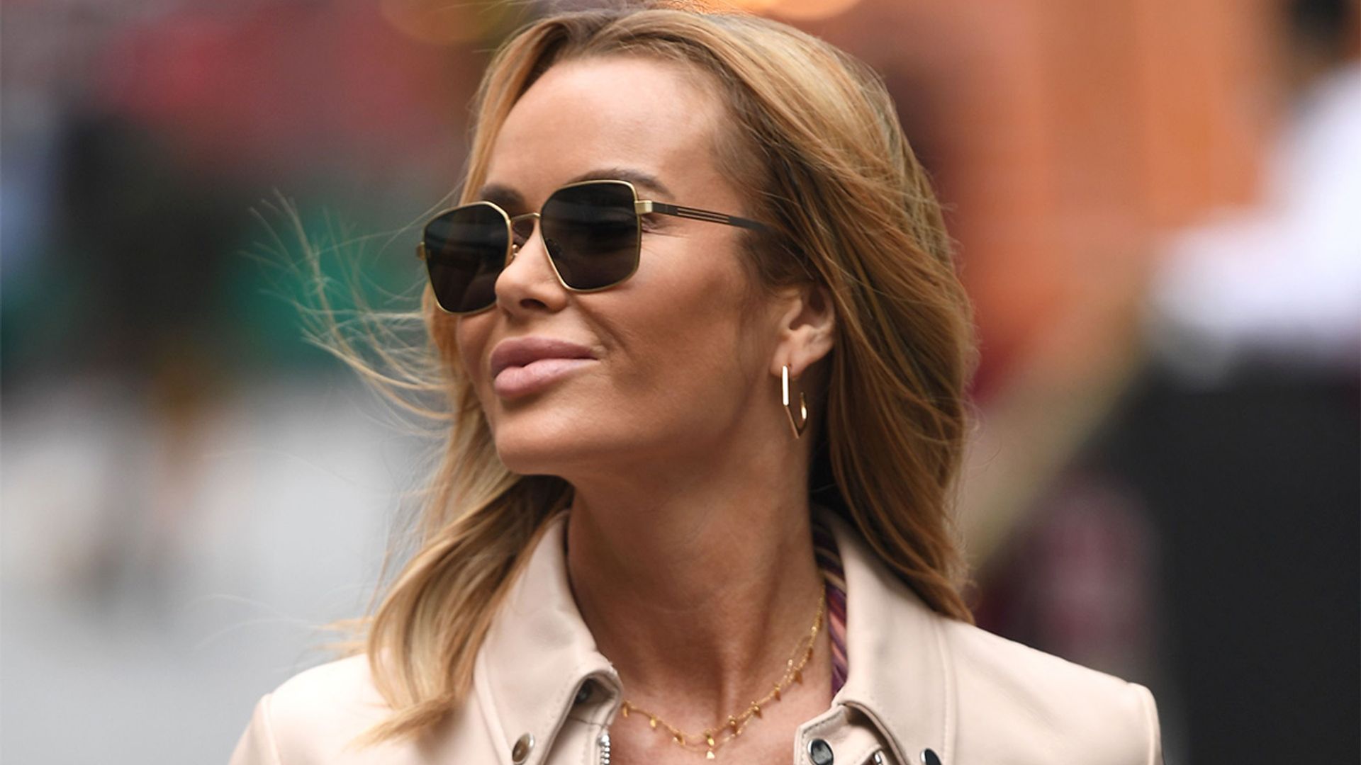 Amanda Holden's pink striped dress makes us want to go on holiday