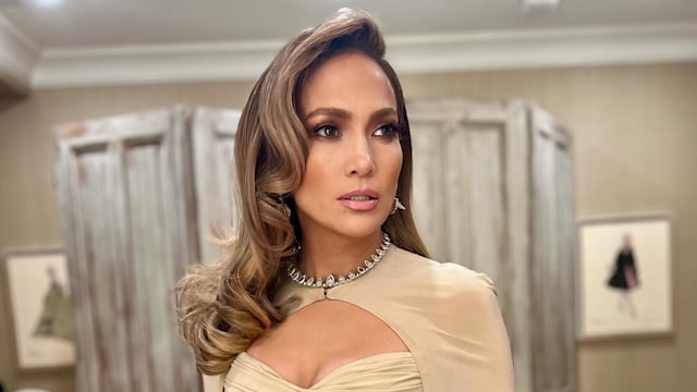 Jennifer Lopez wears a beige gown and cape look on her Instagram