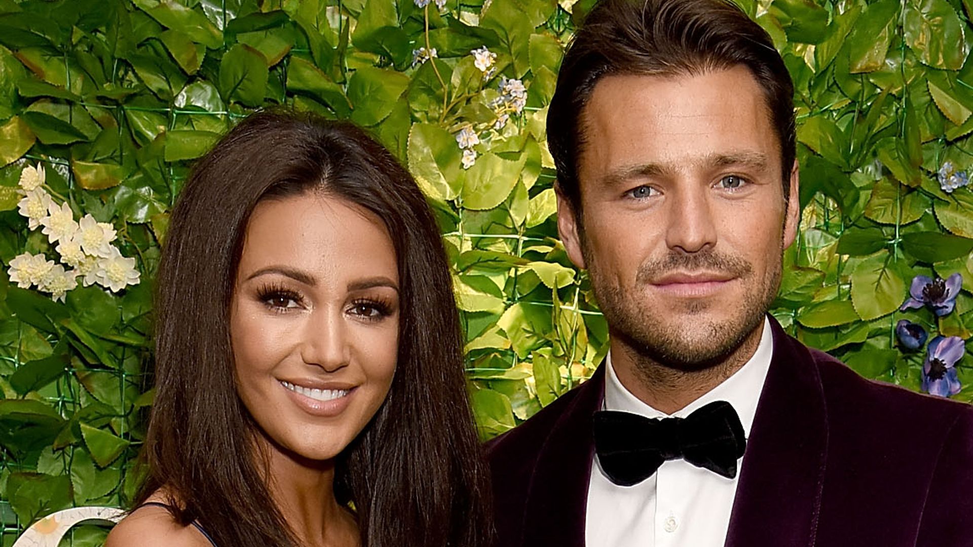 Mark Wright in a velvet jacket and Michelle Keegan in a blue dress