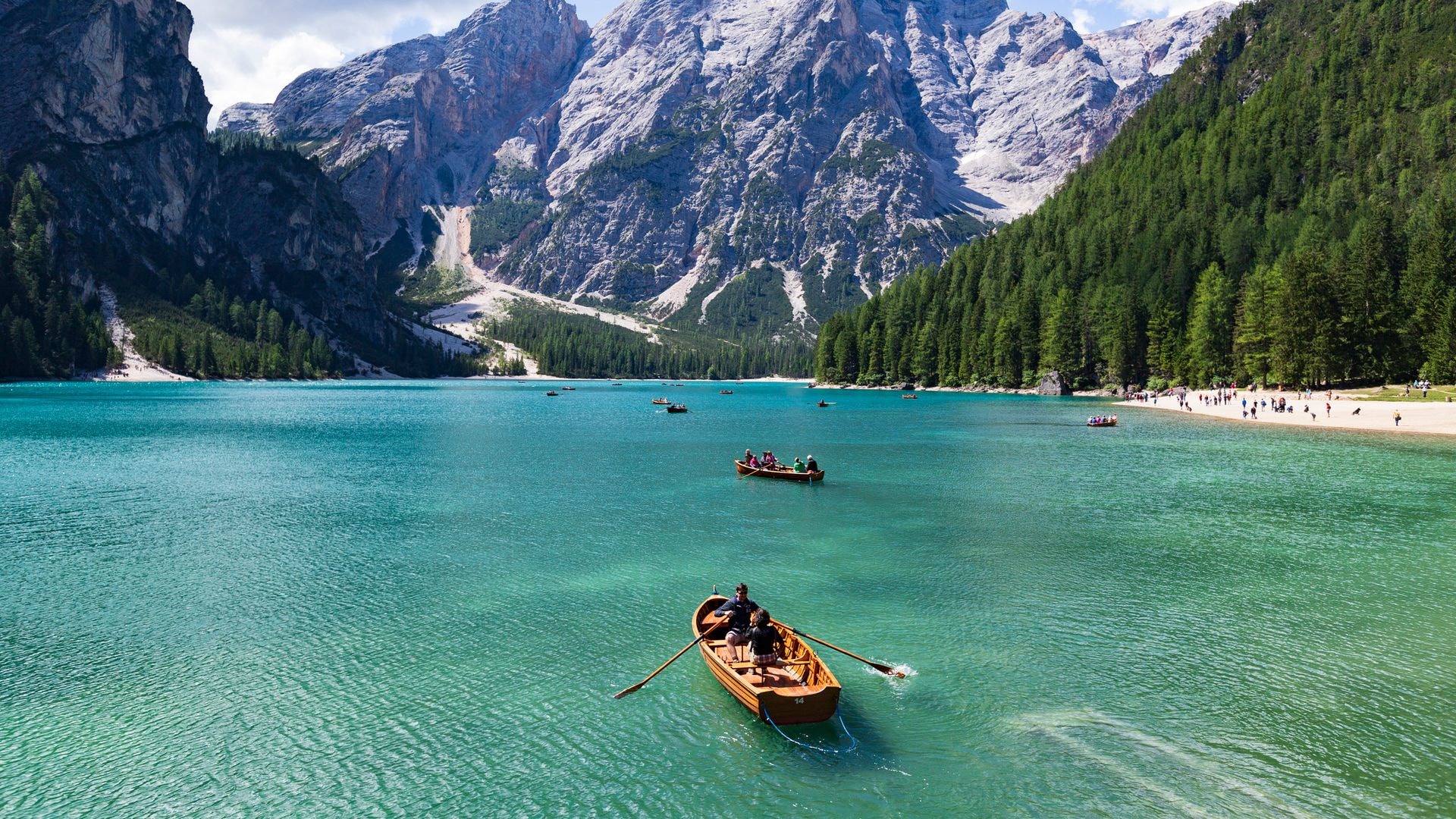 Tourism sailing boat in Lake braies, Dolomite, Italy.