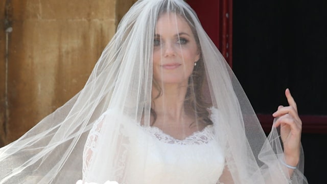 Geri Halliwell wearing a wedding dress and veil