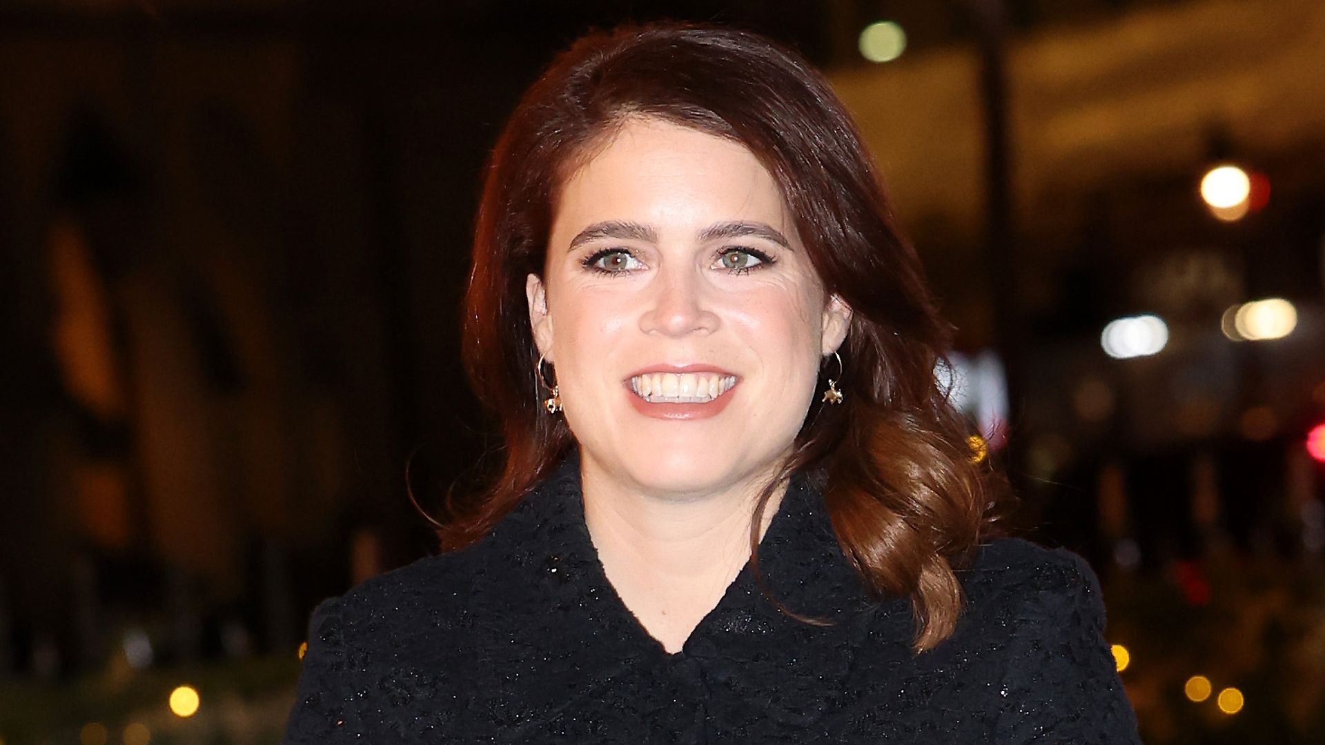 Princess Eugenie in black coat-dress and leather boots