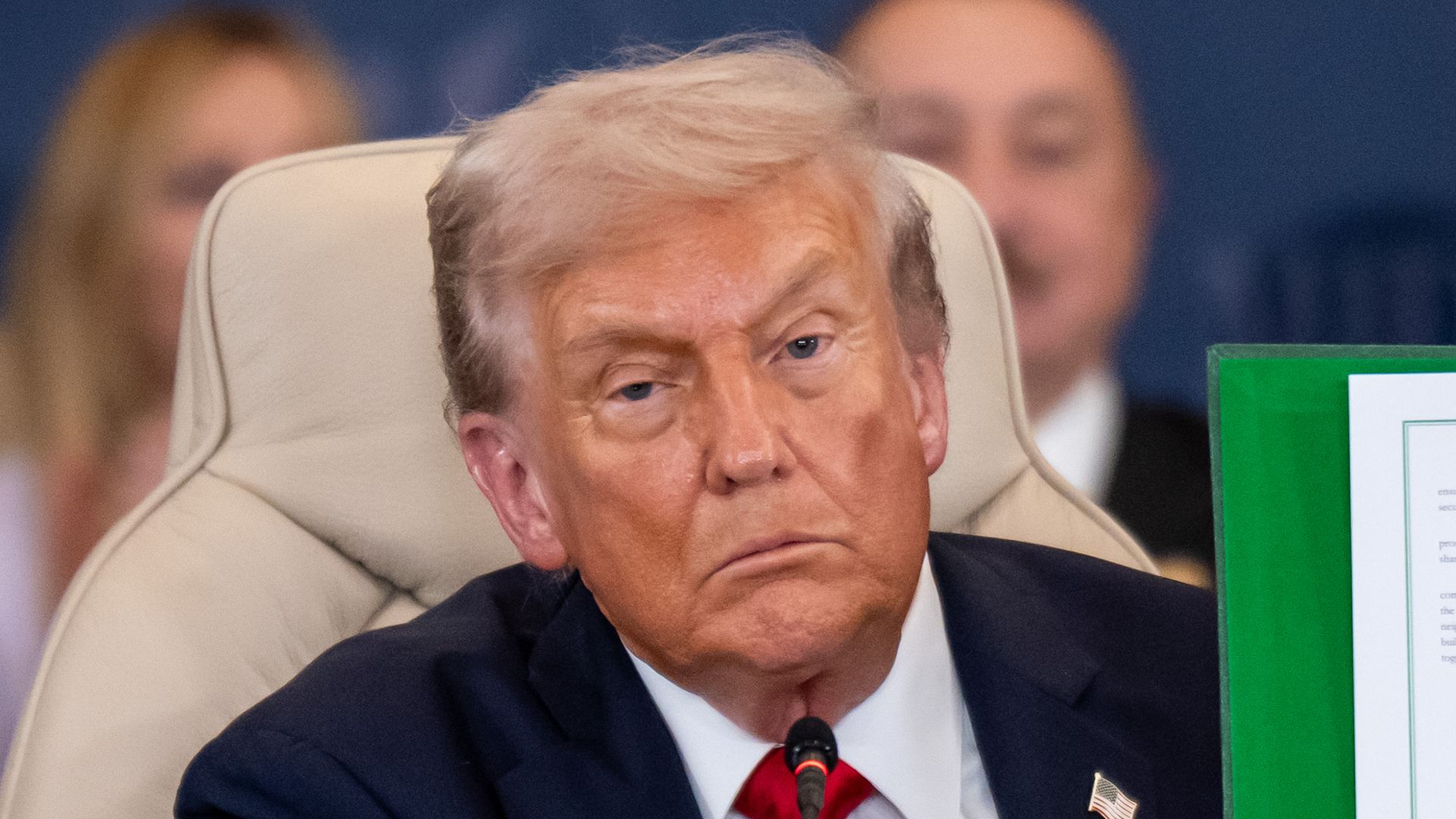 Donald Trump shows the signed peace treaty at the Gaza summit chaired by Egypt's President Al-Sisi